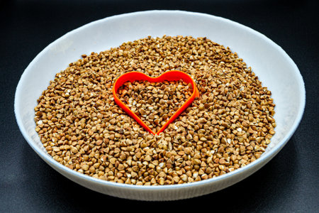 Beautiful organic dry buckwheat grains consisting of raw natural product. Dry buckwheat grains this is tasty food ingredient of porridge. Edible and healthy of dry hulled buckwheat grains from natureの写真素材