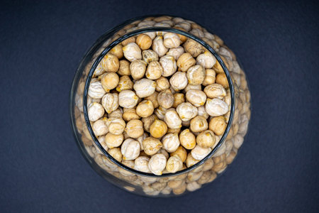 Beautiful organic dried chickpea beans consisting of raw Bengal legume pea. Dry egyptian legume pea seeds this is tasty food ingredient of chickpea beans. Edible healthy chickpea beans in legume peaの写真素材