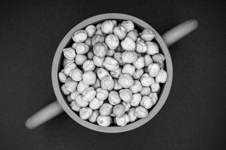 Beautiful organic dried chickpea beans consisting of raw Bengal legume pea. Dry egyptian legume pea...