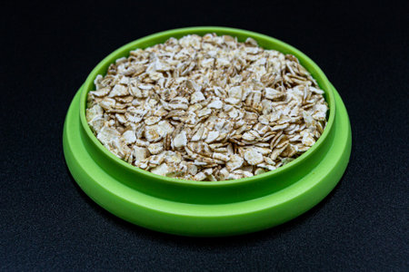 Many delicious flakes oat on grocery market counter, tasty organic food consisting of fresh raw flakes oat close up, beautiful texture ripe of natural flakes oat on backgroundの写真素材