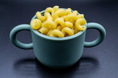 Many delicious Italian pasta on grocery market counter, tasty organic food consisting of fresh raw...