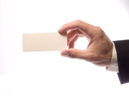 Hand with an empty beige card on a white backgroundの写真素材