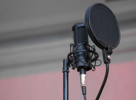 Concert microphone on a stand with a pop filterの写真素材
