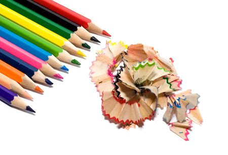 sharpened colored pencils with the chips on a white backgroundの写真素材