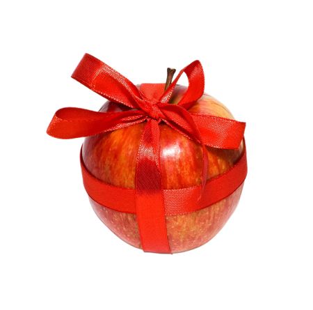 red apple with a gift bow on a white backgroundの写真素材