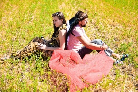 Young happy couple on the field. Shoot on the nature.の写真素材