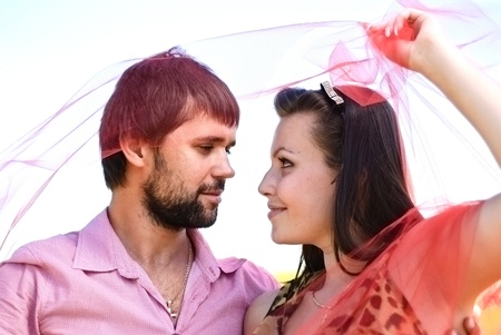 Young happy couple on the field. Shoot on the nature.の写真素材