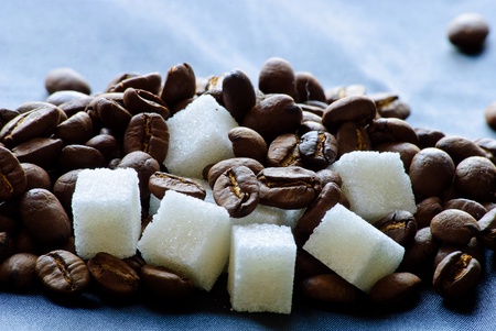 Close-up of roasted coffee beans and sugar.の写真素材
