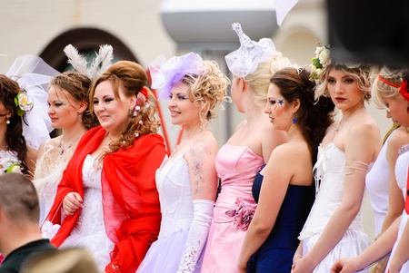 DONETSK, UKRAINE - MAY 15: Annual wedding parade. Bride parade participants in wedding gowns poses during the "Bride Parade" in Donetsk - May 15, 2011 in Donetsk, Ukraine.のeditorial素材