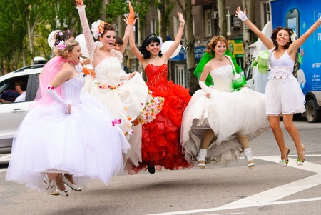 DONETSK, UKRAINE - MAY 15: Annual wedding parade. Bride parade participants in wedding gowns poses during the "Bride Parade" in Donetsk - May 15, 2011 in Donetsk, Ukraine.のeditorial素材