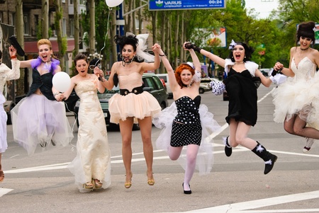 DONETSK, UKRAINE - MAY 15: Annual wedding parade. Bride parade participants in wedding gowns poses during the "Bride Parade" in Donetsk - May 15, 2011 in Donetsk, Ukraine.のeditorial素材