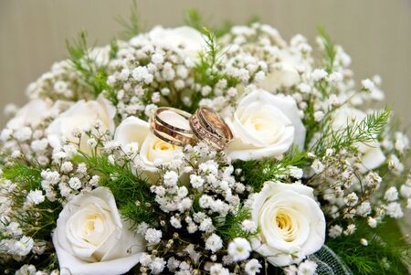 Wedding rings on a bridal bouquetの写真素材