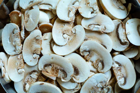 Bowl with champignons mushrooms. Top close-up view.の写真素材