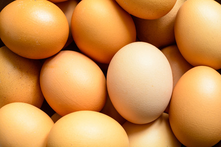 Fresh natural raw hen eggs. Close up top view. Food background.の写真素材