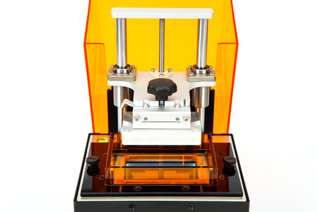 Small home 3D printer on a white background. Studio shot.