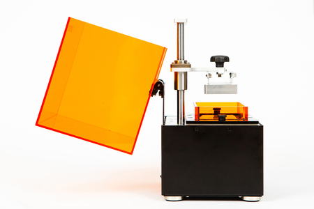 Small home 3D printer on a white background. Studio shot.