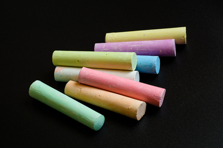 Colorful crayons on a black background. Close-up top view.の写真素材