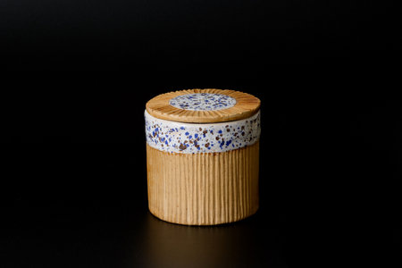 Photography of the authentic handmade ceramic craft ware on a black background. Cup.の写真素材