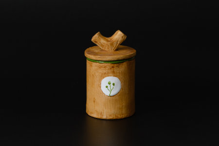 Photography of the authentic handmade ceramic craft ware on a black background. Cup.の写真素材