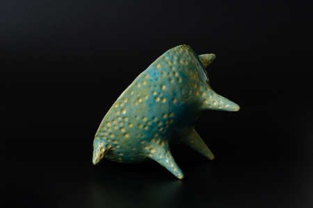 Photography of the authentic handmade ceramic craft ware on a black background. Bowl.の写真素材