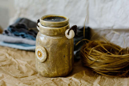 Photography of the authentic handmade ceramic craftware in a cozy home interior.の写真素材