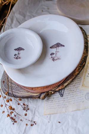 Photography of the authentic handmade ceramic craftware in a cozy home interior. Plate.の写真素材