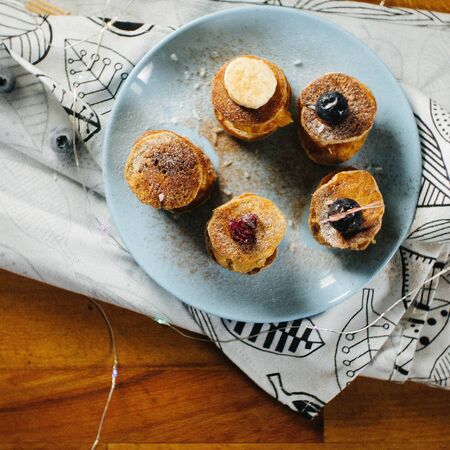 Pancakes with peanut butter on a white table. Top view fresh for background. Blueberries, Banana, Peanut Butterの写真素材