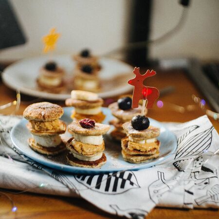 Pancakes with peanut butter on a white table. Top view fresh for background. Blueberries, Banana, Peanut Butterの写真素材