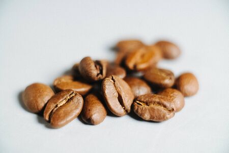 close-up of coffee grains on a white backgroundの写真素材