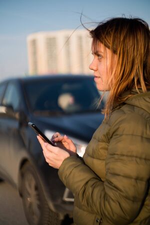 Young girl signs a realtor car sale contractの写真素材
