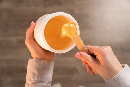 female hands top view piece of sugar pasteの写真素材