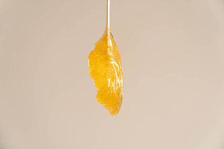 large slice of sugar paste on wooden spatulaの写真素材