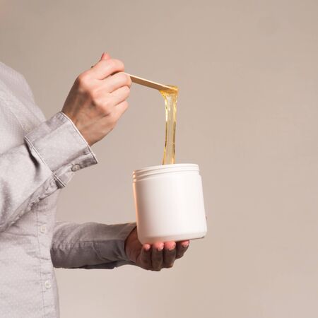 shugaring paste stretched with spatula upwards vertical frameの写真素材