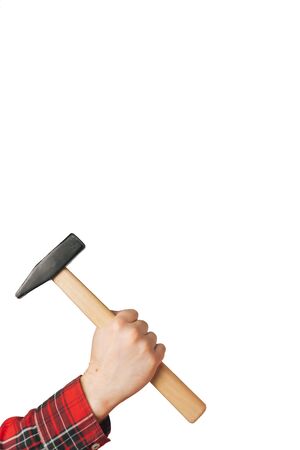 A man holds a hammer in his hand on a white background isolation. Copy space on top. Construction Tools Sale Concept.の写真素材
