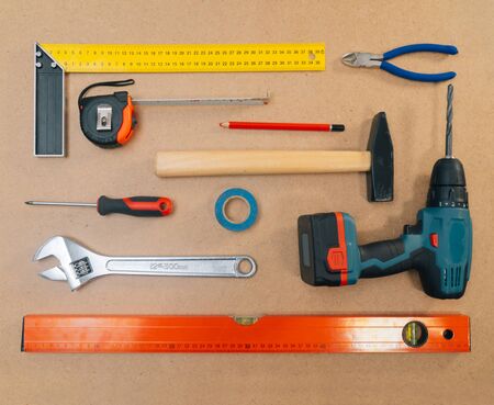 Construction tools on a light background. The concept of using tools to make repairs in an apartment.の写真素材