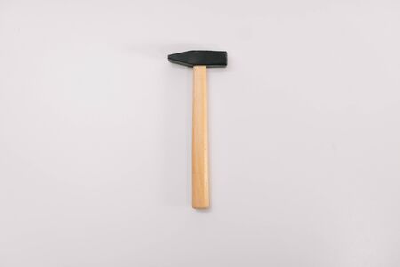 wooden work hammer on a white background isolation. Copy space on top. Construction Tools Sale Concept.の写真素材