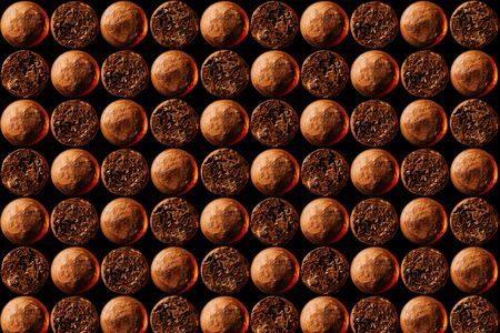 Cuban cigars look in front and behind a close-up pattern. The concept of the background.Horizontal layout.の写真素材