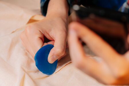 Tailor chalk close-up to translate a sketch of clothing into fabric. drawing a lay-up close-up in the time of the seamstress's trainingの写真素材