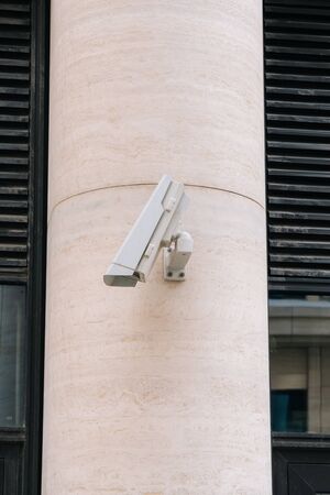 The CCTV camera is down. Kind of broken camera. Installation of a new outdoor camera to protect the building.の写真素材