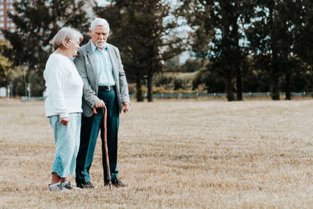Elderly retired people walk in the fresh air. The concept of disease prevention. Older married coupleの写真素材