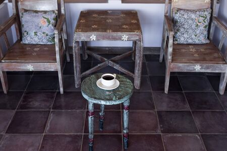 Black hot coffee on round vintage wooden tableの写真素材