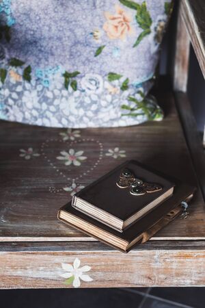 Vintage notebook with leather cover on the wooden tableの写真素材