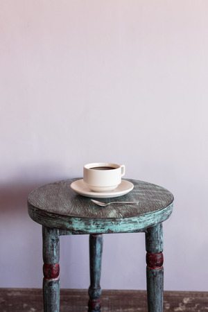 Black hot coffee on round vintage wooden tableの写真素材