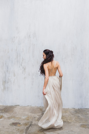 Bride dancing in a long gentle silk dress fineart styleの写真素材
