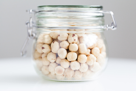 Transparent jar with nutsの写真素材