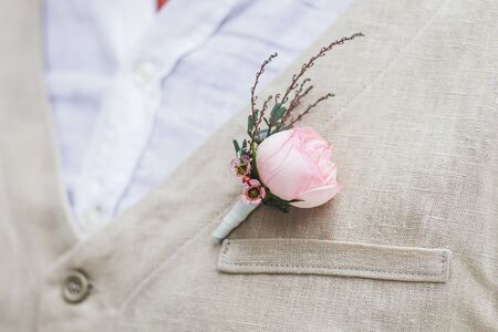 Gentle groom boutonniere with a rose