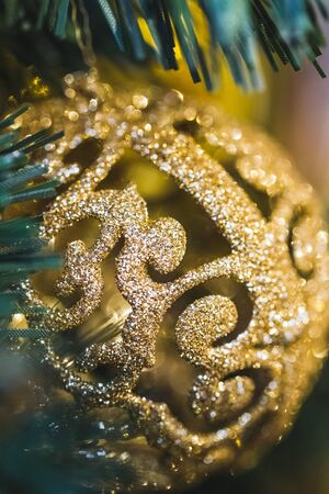Beautiful shiny texture of glare gold Christmas balls close-upの写真素材