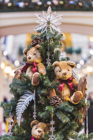 Christmas tree decorated with small teddy bearsの写真素材