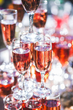 Stack of glasses of champagne at the reception in the open airの写真素材