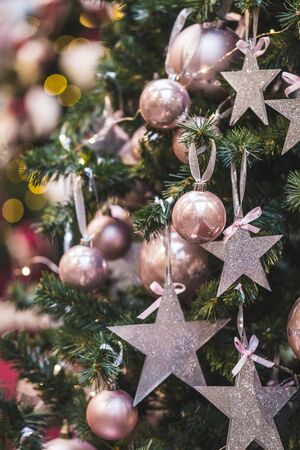 Decoration of the Christmas tree in the form of shiny gold stars, New Year moodの写真素材
